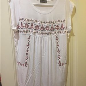 White top with floral detail